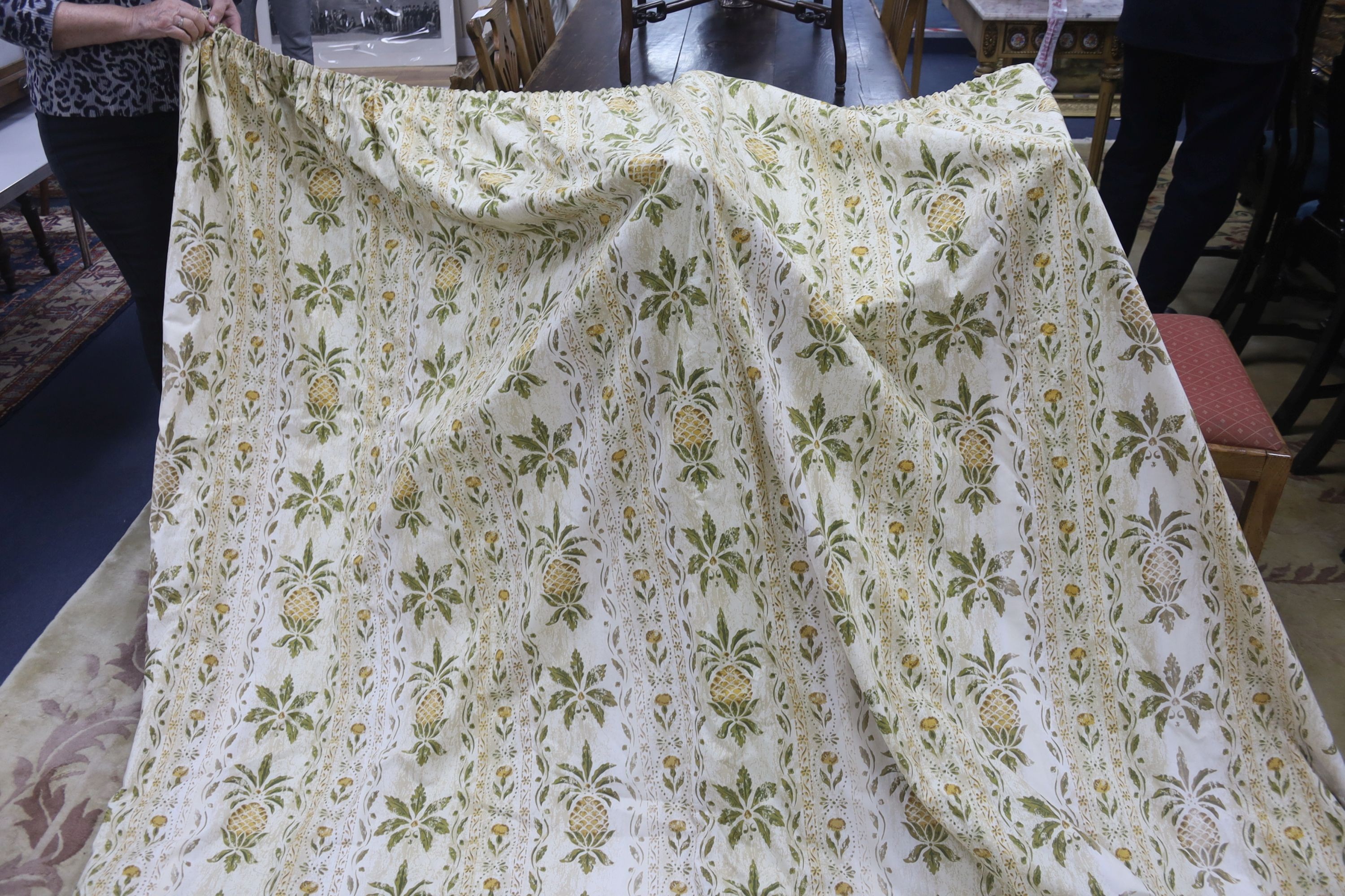A pair of linen, 'Morris' style curtains and another pair of cotton curtains with a pineapple design